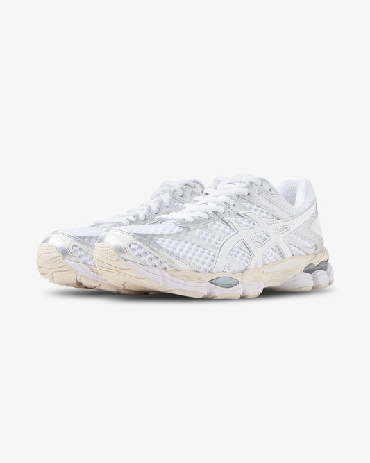 White Asics Gel Cumulus 16 sneaker, angled front view