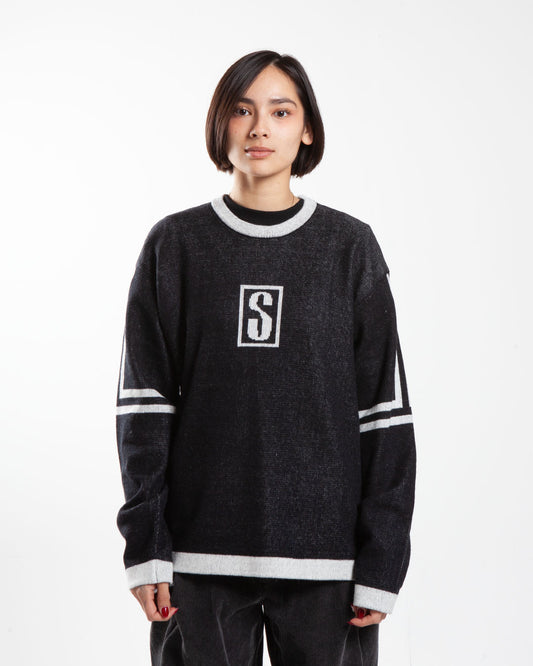 Black Stüssy sweater, front view, chest logo