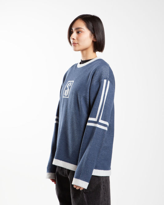 Alpine blue Stüssy sweater, side view, chest logo