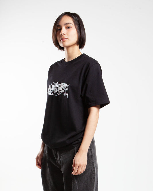 Black Stüssy t-shirt, side view, artwork on chest