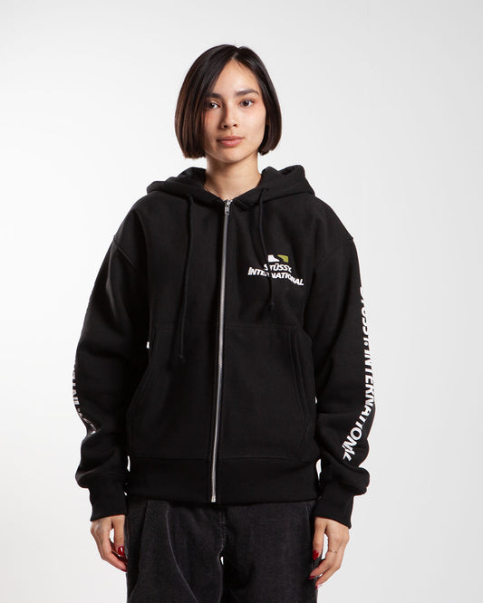 Black Stüssy zip-up hoodie, front view, with text on sleeves