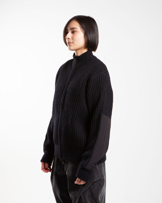 Black Stüssy military patch zip-up, side view