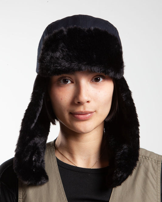 Black Stüssy trapper cap, front view